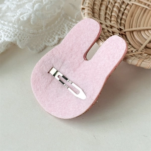 Pink rabbit felt hair clip with silver metal snap fastener shown from the back view
