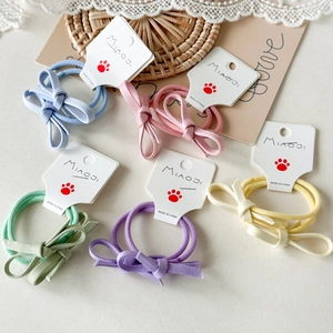 Set di elastici per capelli con fiocco macaron per bambine su cartoncini bianchi colori