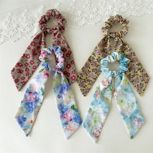 Floral print hair scrunchies with long ribbons in colorful oil painting styles