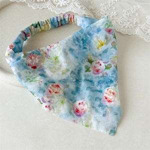 Detailed view of light blue floral headscarf with pink roses and elastic band