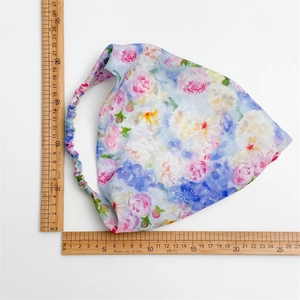 Detailed size measurement of a floral chiffon headband with elastic band and ruler reference