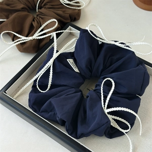 Navy blue and brown scrunchies set with white lace bows and handmade label