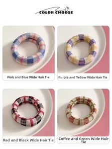 Detail view of four checkered woven hair ties in various vibrant color combinations