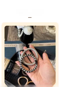 Detail showing durable woven texture and round clasp of high elasticity hair ties