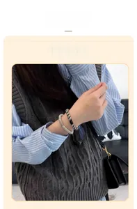Detailed close-up of woven high ponytail elastic hair ties on a model's wrist