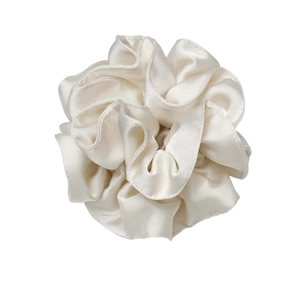 Glossy cream satin oversized scrunchie for women with elegant pleated texture and soft sheen