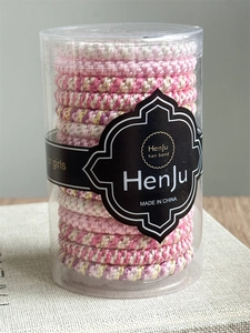 Close-up of durable high-elasticity braided hair bands set in transparent cylindrical packaging