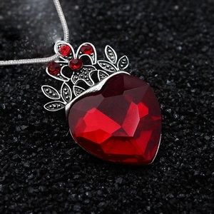 Gothic vintage silver crown necklace with a large red heart gemstone pendant and snake chain