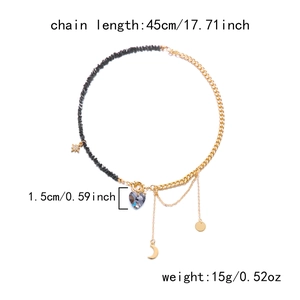 Detail of heart necklace with 45cm length, 1.5cm purple crystal and golden charms