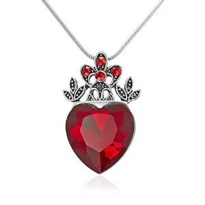 Detailed close-up of a red heart-shaped gemstone necklace with crown motif and silver chain