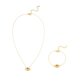 Detailed view of the gold Evil Eye jewelry set featuring blue stones and lobster clasps