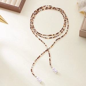 Collana lunga con perline e nappe di perle in stile vintage retrò elegante