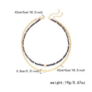 Detailed view of layered necklace showing measurements of the 42cm chain and heart pendant