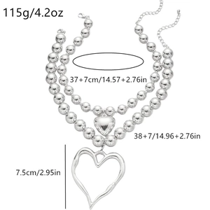 Silver layered bead necklace with large open heart and solid heart charms for women