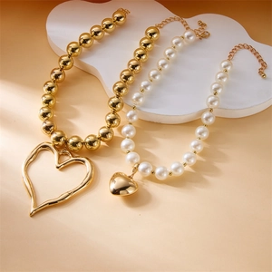 Multilayer gold bead and pearl necklace set with oversized irregular heart pendants