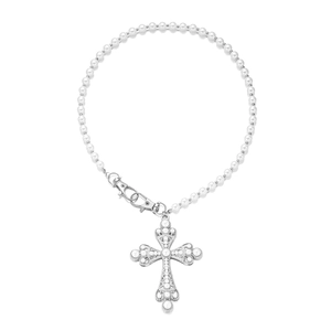Detailed view of punk style pearl trousers chain with ornate silver cross pendant