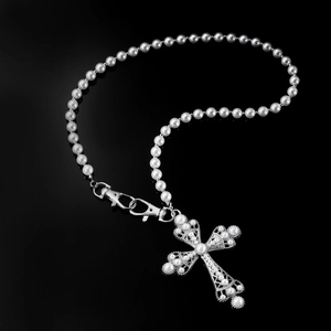 Hip hop pearl trousers chain with ornate cross pendant and silver lobster clasps on black surface