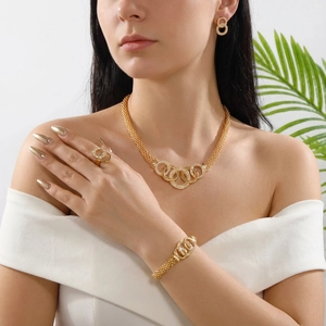 Elegant gold jewelry set with rhinestone pavé interlocking rings for women
