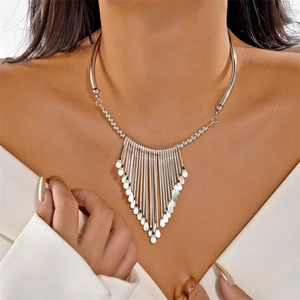 Elegant silver fringe tassel necklace set with geometric water-drop pendants on a model