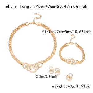 Detailed view of gold plated jewelry set featuring intertwined pavé crystal rings and chains