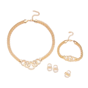 Detailed view of golden jewelry set featuring intertwined rhinestone rings and woven chains