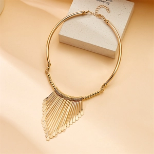 Elegant gold torque necklace with dangling metal tassel charms and adjustable lobster clasp