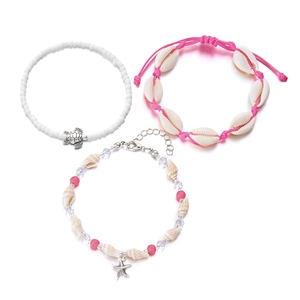 Three-piece beach jewelry set featuring conch shells, turtle charms, and pink woven beads