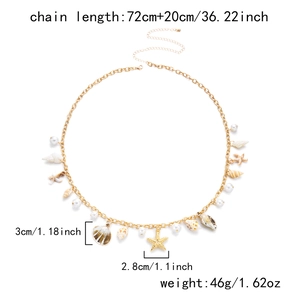 Detailed view of golden double-layer body chain with seashell and starfish pendants