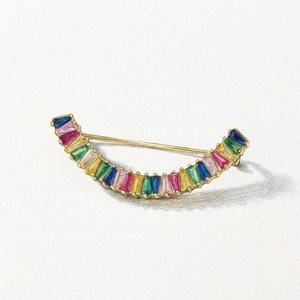 Broche croissant en pierres arc-en-ciel avec placage d'or sur fond de papier d'art