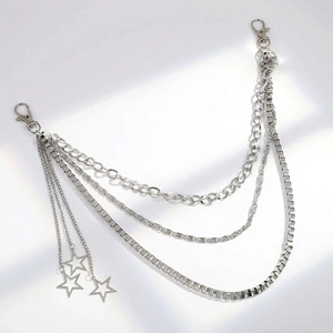 Close-up of multilayer silver metal waist chain with star pendants and lobster clasps