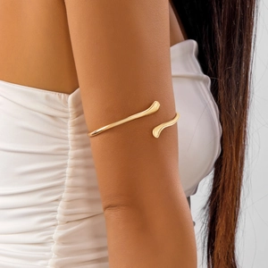Bracelet de bras doré moderne avec motif étoile de mer irrégulier et lignes épurées doubles