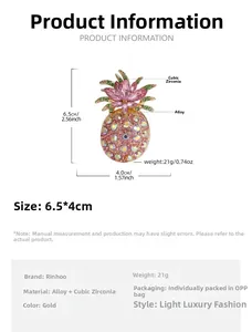 Detailed size view of luxury pineapple brooch with pink rhinestones and green leaves