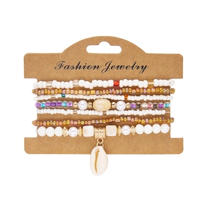 Detail of colorful beaded bracelet set with shell pendant on fashion jewelry card