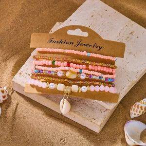 Bohemian multilayer beaded bracelet set with natural shell pendant on a display card