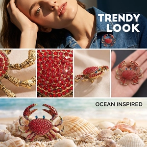 Detailed views of luxury crab brooch with red rhinestones and ocean-inspired design