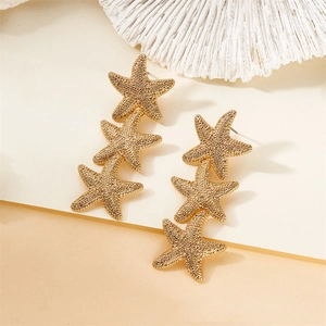 Chic gold-toned triple starfish drop earrings with textured finish for summer beach style
