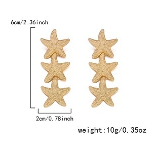 Detailed dimensions of long gold starfish earrings with triple stacked textured design