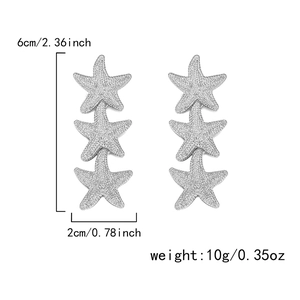 Detailed view of silver starfish drop earrings showing height of 6cm and width of 2cm
