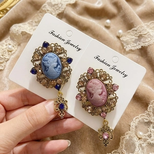 Vintage palace style cameo brooch with crystal relief and hollow pendant details