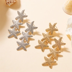 Exaggerated long starfish drop earrings in gold and silver finish with metallic texture