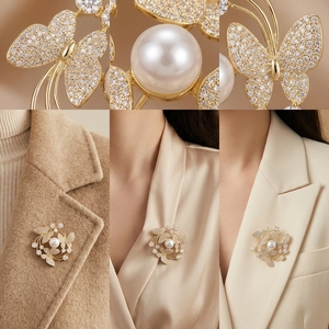 Detailed macro view showing the gold butterfly brooch with white pearl and inlaid zircon