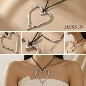 Detail view of silver irregular heart pendant with black leather cord and lobster clasp