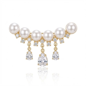 Elegant gold curved brooch with six white pearls and three teardrop zircon pendants