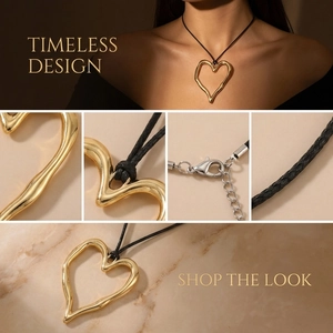 Detail of gold heart pendant necklace featuring black cord and adjustable lobster clasp