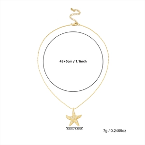 Detail view of a gold starfish necklace with dimensions, weight and sparkling rhinestones