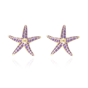 Detailed macro view of bohemian purple starfish earrings with gold-plated metal edges