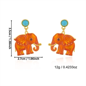Detail view of elephant earrings with orange enamel and turquoise stone, size 3.5cm by 2.7cm