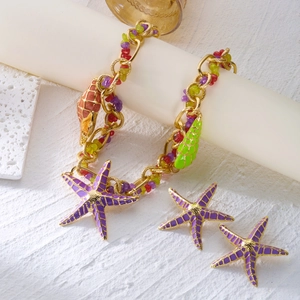Bohemian ocean jewelry set with gold starfish necklace, shell beads and matching earrings