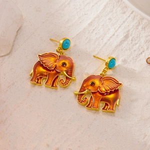 Detailed view of elephant drop earrings with orange enamel and turquoise beads
