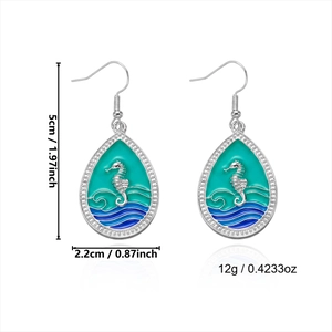 Detailed size view of turquoise enamel seahorse drop earrings with dimensions in inches